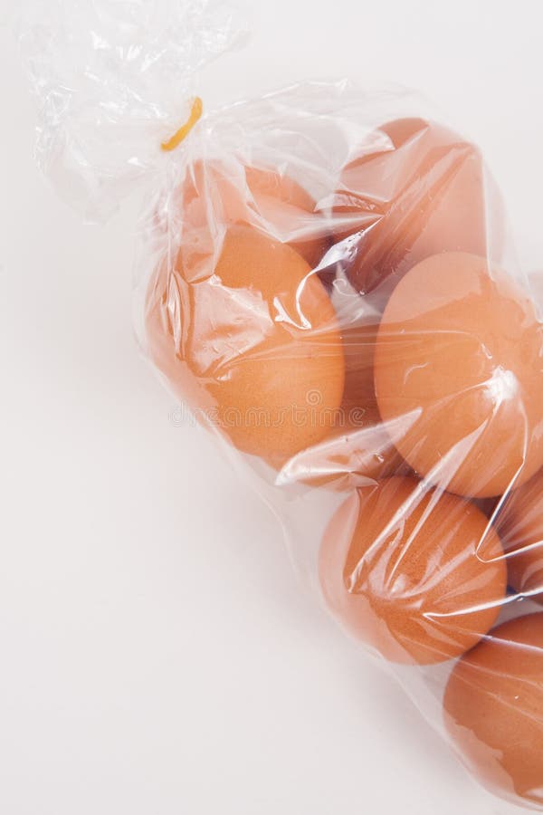 Fresh eggs in plastic bag stock photo. Image of shadows 101042360