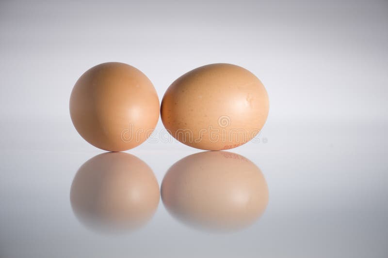 Eggs on glossy table with reflection. Eggs on glossy table with reflection