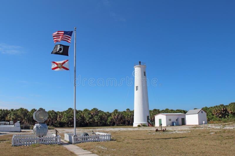 The Egmont Key Lighthouse and Flags in Tampa Bay, Florida Editorial