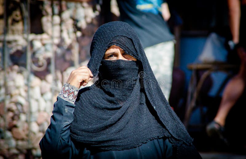 Egyptian woman hidden behind scarf of niqab