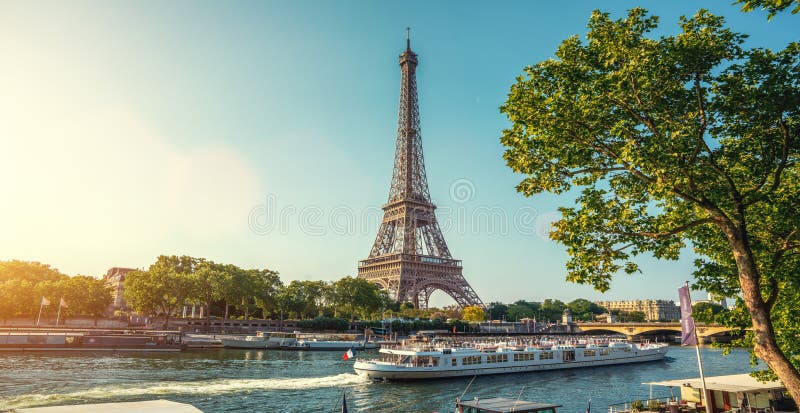 The eifel tower in Paris from a tiny street stock photo The eifel tower in Paris from a tiny street stock photo