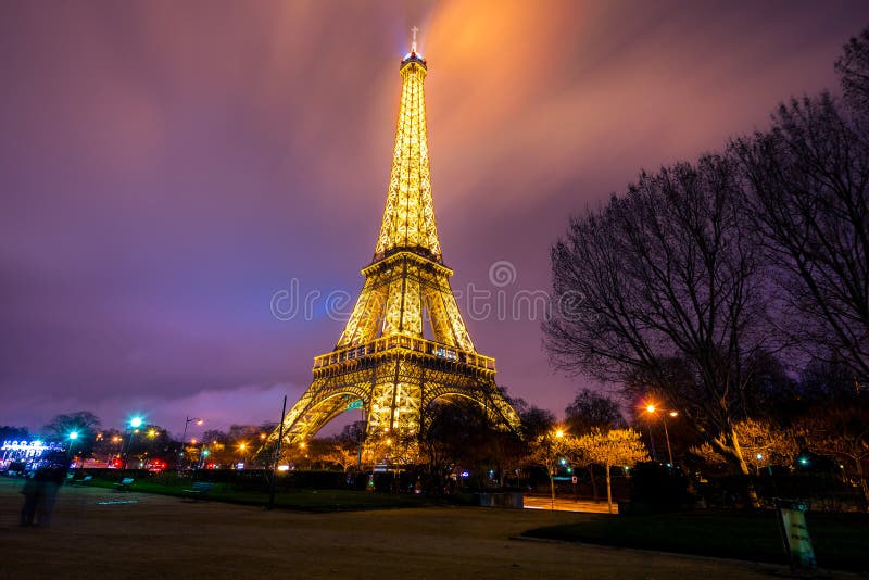 Eiffel Tower Brightly Illuminated At Dusk Editorial Photography