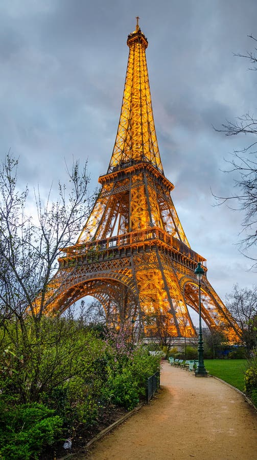 The Eiffel Tower Lit Up at Night from the Champ De Mars Park Editorial