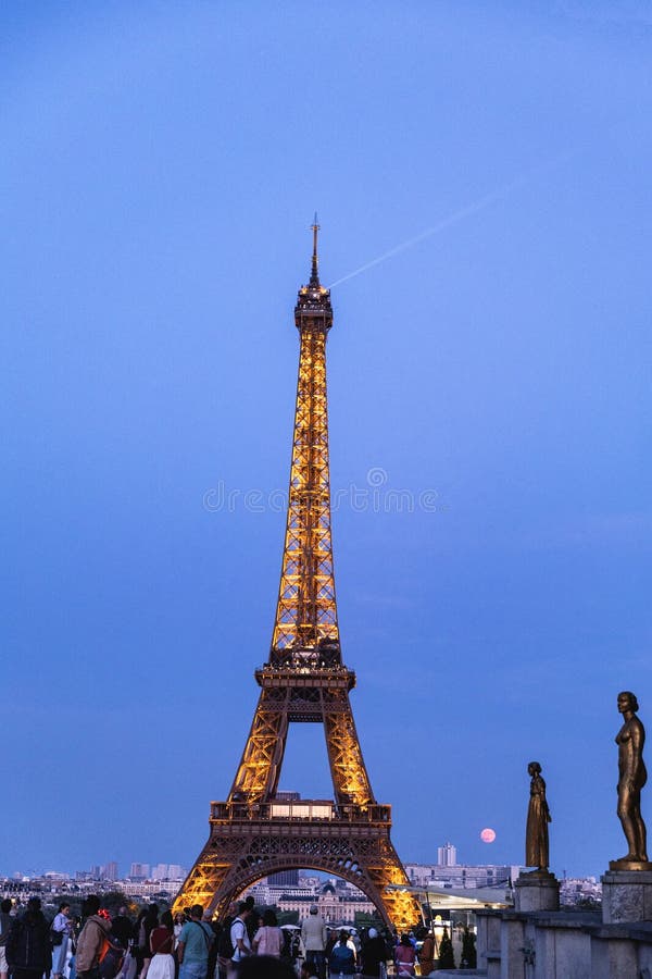 The Eiffel Tower at night dazzles with thousands of sparkling lights stock images
