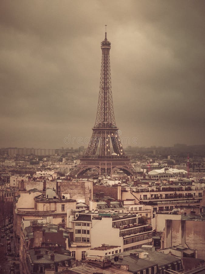 Eiffel tower and rooftops, Paris, France, vintage old color photo effect, view from Arc de Triomphe stock photography Eiffel tower and rooftops, Paris, France, vintage old color photo effect, view from Arc de Triomphe stock photography