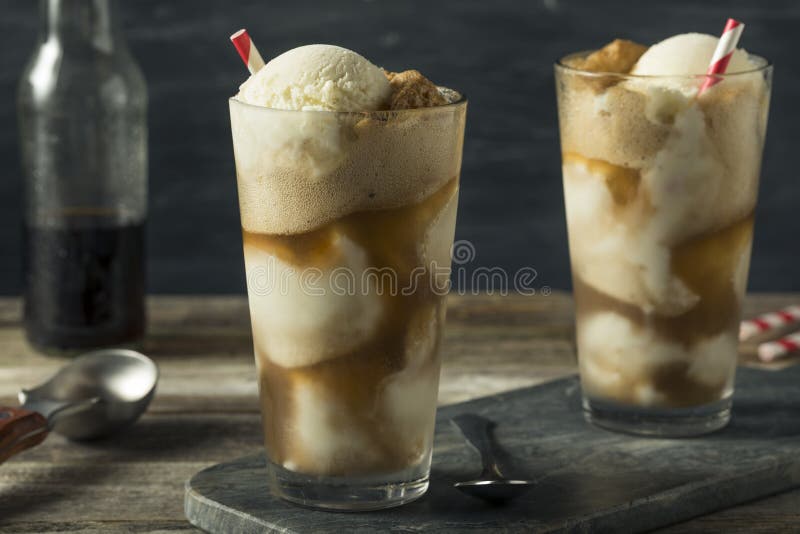 Homemade Soda Black Cow Ice Cream Float with a Straw. Homemade Soda Black Cow Ice Cream Float with a Straw