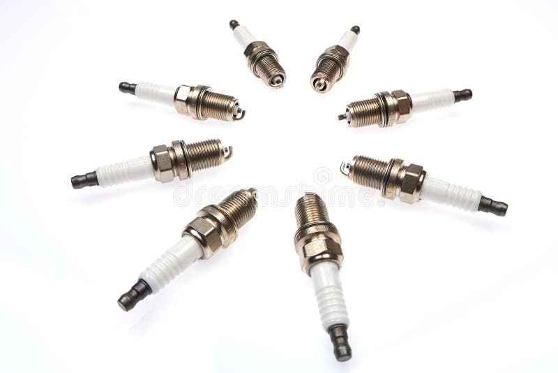 4 Spark Plugs with a Magnifying Glass Stock Image Image of assembly