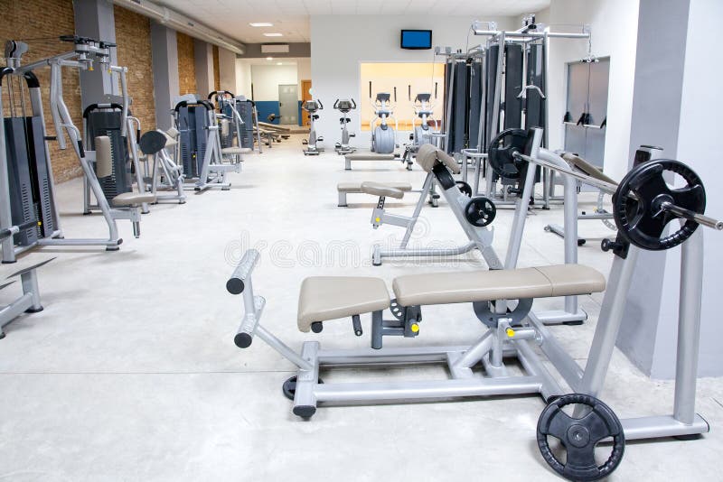 Fitness club gym with sport equipment modern interior. Fitness club gym with sport equipment modern interior