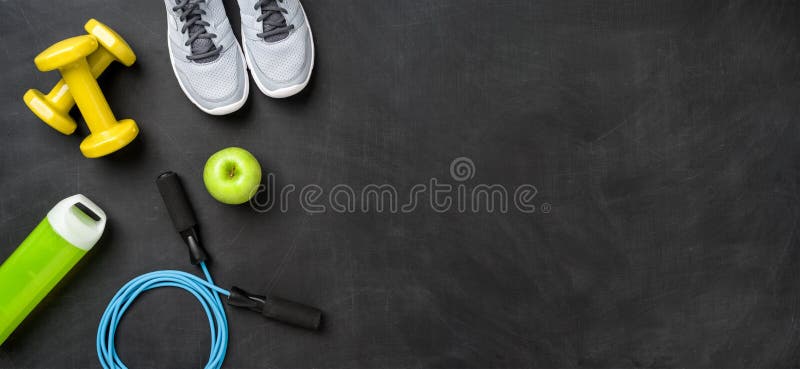 Fitness equipment on a dark background with copy space. Fitness equipment on a dark background with copy space