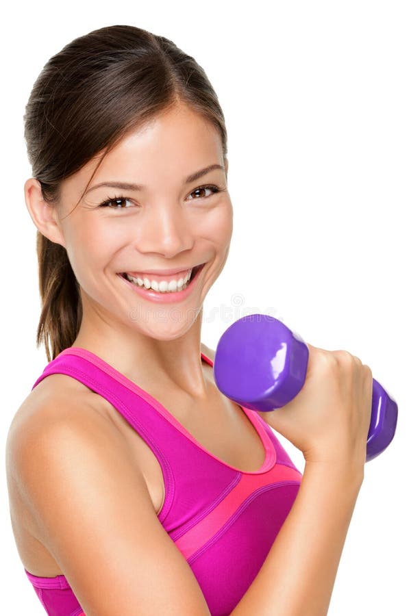 Fitness sport girl smiling happy. Fitness woman lifting dumbbells strength training biceps doing curls. Mixed Caucasian and Asian fitness model portrait isolated on white background. Fitness sport girl smiling happy. Fitness woman lifting dumbbells strength training biceps doing curls. Mixed Caucasian and Asian fitness model portrait isolated on white background.