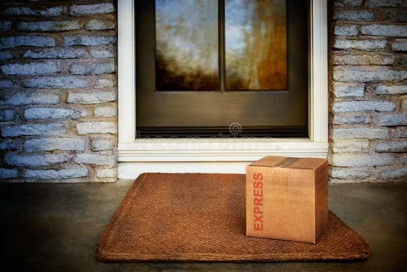 Priority shipping. Online order express box delivered on mat in front of home`s door. Priority shipping. Online order express box delivered on mat in front of home`s door.
