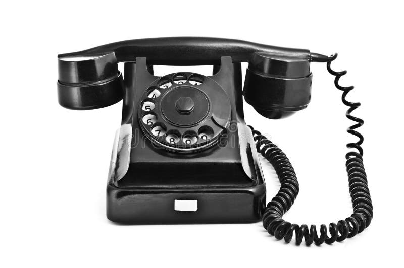 An old black vintage rotary style telephone isolated over a white background. An old black vintage rotary style telephone isolated over a white background.