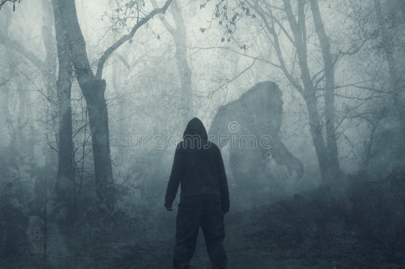 A dark scary concept. Of a mysterious bigfoot figure, walking through a forest. Silhouetted against trees in a forest. With a grunge, textured edit. A dark scary concept. Of a mysterious bigfoot figure, walking through a forest. Silhouetted against trees in a forest. With a grunge, textured edit..