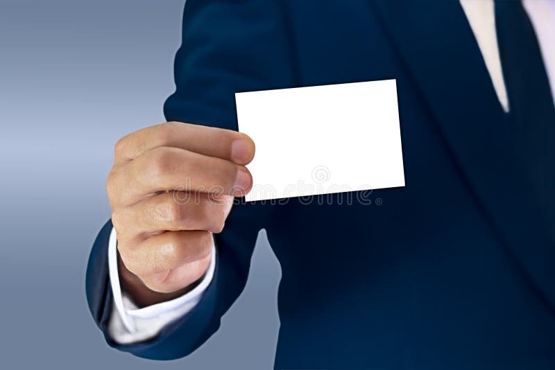Ein Geschäftsmann steht elegant in einer blauen Klage und in einem showin angekleidet stockbild Ein Geschäftsmann steht elegant in einer blauen Klage und in einem showin angekleidet stockbild