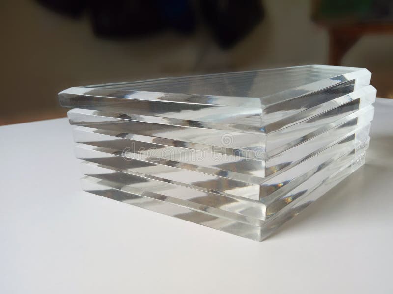 a bunch of acrylic glass in a pile in a room. clear material with a square shape for craft souvenirs. a bunch of acrylic glass in a pile in a room. clear material with a square shape for craft souvenirs