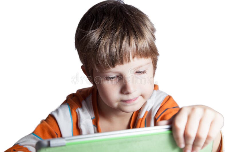 Ein Junge mit einem Tablet-Computer lizenzfreie stockfotos Ein Junge mit einem Tablet-Computer lizenzfreie stockfotos