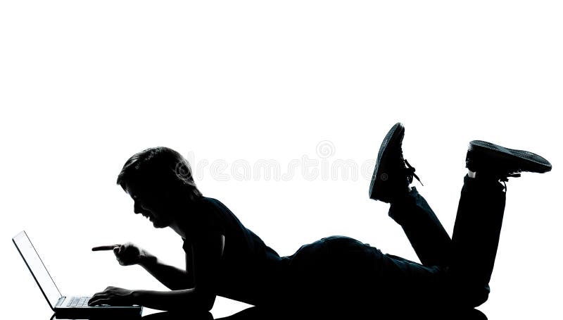 Ein junger Jugendlichjungenmädchenschattenbild-Computer Datenverarbeitungslapto stockfoto Ein junger Jugendlichjungenmädchenschattenbild-Computer Datenverarbeitungslapto stockfoto