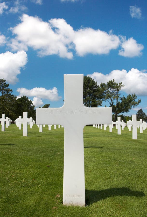 One cross heading a row in the American cemetary of WWII in Normandy, France. One cross heading a row in the American cemetary of WWII in Normandy, France