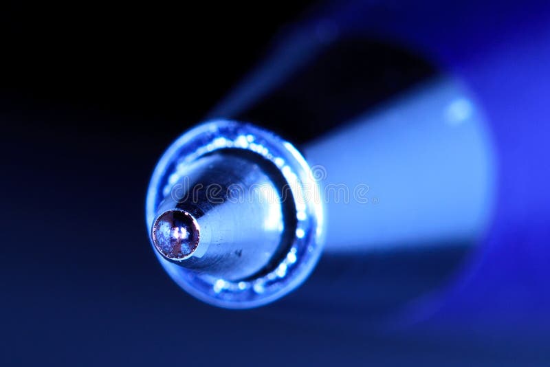 A macro shot of the tip of a ball point pen. A macro shot of the tip of a ball point pen