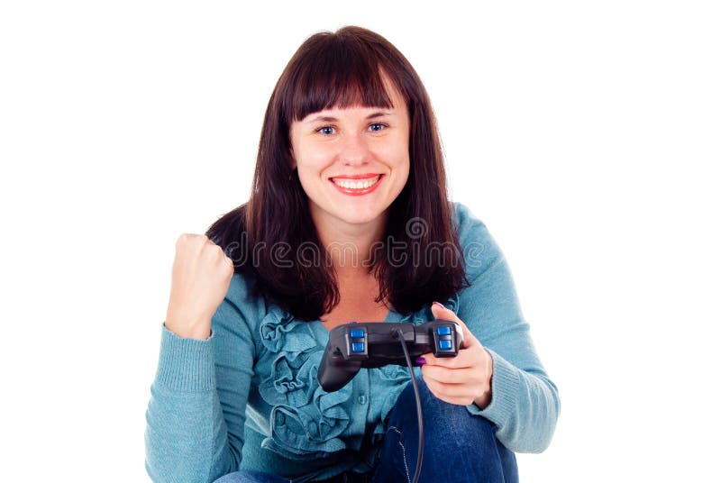 Ein Mädchen, welches die Videospiele, den Sieg freuend spielt lizenzfreies stockbild Ein Mädchen, welches die Videospiele, den Sieg freuend spielt lizenzfreies stockbild