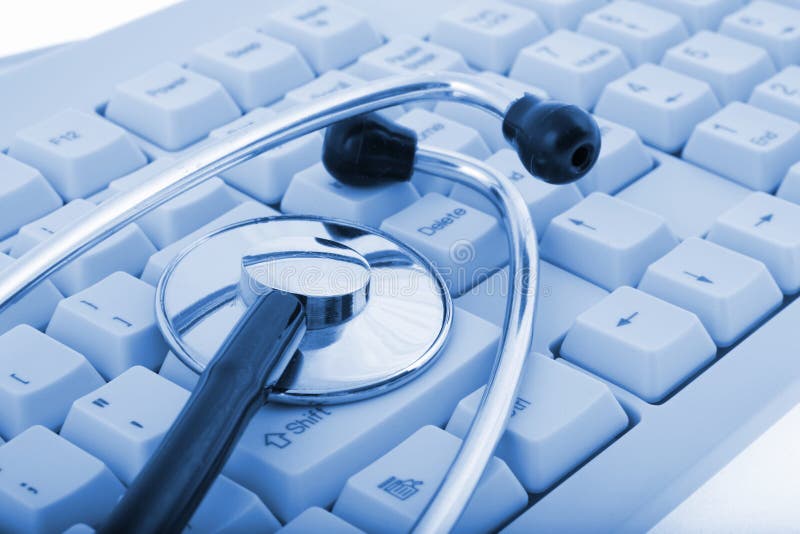 A stethoscope on a computer keyboard (on blue tone). A stethoscope on a computer keyboard (on blue tone)