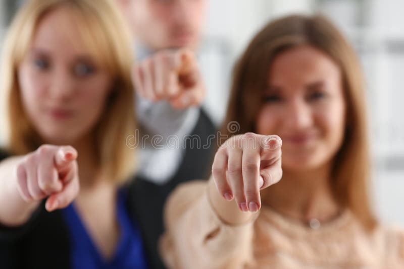 A group of business people pointing their finger at the camera and saying we choose you are engaged in a posse of employees and selecting the prosessians for the customer. A group of business people pointing their finger at the camera and saying we choose you are engaged in a posse of employees and selecting the prosessians for the customer.