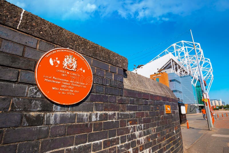 Eine Plakette im Denkmal von James W Gibson, Vorsitzender von Manchester United von 1931-1951 lizenzfreies stockbild Eine Plakette im Denkmal von James W Gibson, Vorsitzender von Manchester United von 1931-1951 lizenzfreies stockbild
