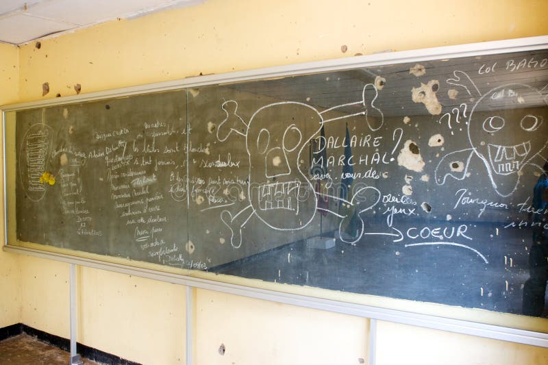 A school chalkboard in Camp Kigali. Note the names Dallaire, UNAMIR Force Commander, and Marchal, UNAMIR Kigali sector commander. Today, the Camp is a Belgian commemoration. It hosts a small museum. Shortly after the death of Rwandan President Juvenal Habyarimana in a plane crash on April 6, 1994, Lotin and his men were given orders about 2 a.m. the next day to take Prime Minister Agathe Uwilingiyimana to the radio station to make an appeal for calm. When the 10 peacekeepers arrived at the prime minister's house, soldiers of the Hutu army opened fire. The prime minister was caught and murdered. Lotin and his men were taken to a Rwandan military base, where an officer accused Belgian troops of shooting down the president's plane. Soldiers at the base went wild with machetes, bayonets and guns. Four of the paratroopers were cut down immediately. Lotin and the rest ran to a building, where another was trapped and killed. A Rwandan soldier tried to break into the room where the survivors barricaded themselves, but Lotin killed him with a pistol he had kept hidden and grabbed the soldier's AK-47 rifle. The Belgians held out with those two weapons for three hours, when grenades dropped into the room through the roof ended resistance. All the bodies were stripped of valuables and mutilated. Two weeks later, faced with a shocked and distraught nation, Belgium's government withdrew its 450-man battalion from the U.N. force in Rwanda. A school chalkboard in Camp Kigali. Note the names Dallaire, UNAMIR Force Commander, and Marchal, UNAMIR Kigali sector commander. Today, the Camp is a Belgian commemoration. It hosts a small museum. Shortly after the death of Rwandan President Juvenal Habyarimana in a plane crash on April 6, 1994, Lotin and his men were given orders about 2 a.m. the next day to take Prime Minister Agathe Uwilingiyimana to the radio station to make an appeal for calm. When the 10 peacekeepers arrived at the prime minister's house, soldiers of the Hutu army opened fire. The prime minister was caught and murdered. Lotin and his men were taken to a Rwandan military base, where an officer accused Belgian troops of shooting down the president's plane. Soldiers at the base went wild with machetes, bayonets and guns. Four of the paratroopers were cut down immediately. Lotin and the rest ran to a building, where another was trapped and killed. A Rwandan soldier tried to break into the room where the survivors barricaded themselves, but Lotin killed him with a pistol he had kept hidden and grabbed the soldier's AK-47 rifle. The Belgians held out with those two weapons for three hours, when grenades dropped into the room through the roof ended resistance. All the bodies were stripped of valuables and mutilated. Two weeks later, faced with a shocked and distraught nation, Belgium's government withdrew its 450-man battalion from the U.N. force in Rwanda.