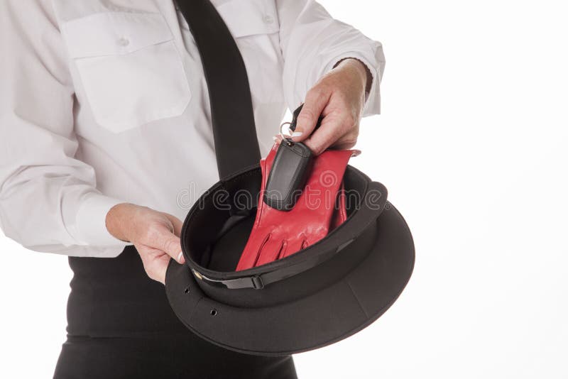 Einheitlicher Hut und Handschuhe des Fahrers lizenzfreie stockfotos