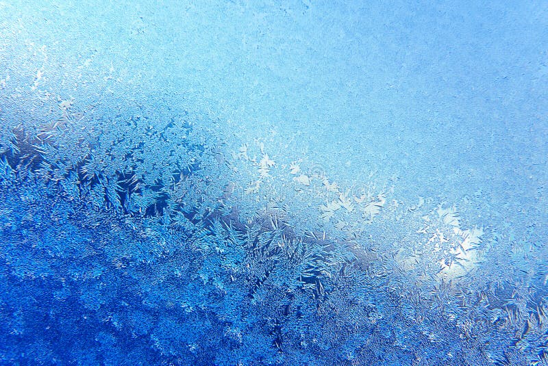 Blue formation of snow pattern on closeup window. Blue formation of snow pattern on closeup window