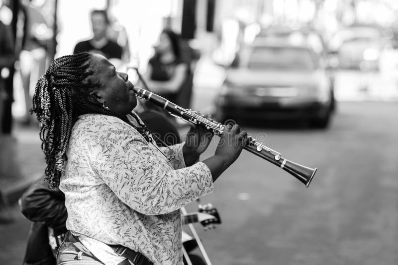 New Orleans, USA - Jan 19 2013: Local jazz band performs in the streets for money in New Orleans, USA. New Orleans, USA - Jan 19 2013: Local jazz band performs in the streets for money in New Orleans, USA