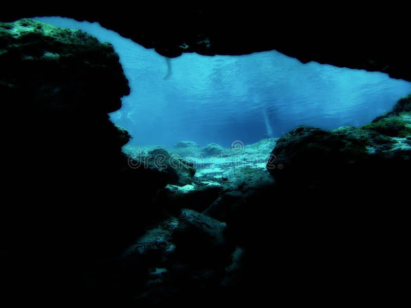 Looking onto open waters from an underwater cave or cavern at Ginnie Springs in Gilchrist County, Florida (USA). Looking onto open waters from an underwater cave or cavern at Ginnie Springs in Gilchrist County, Florida (USA).