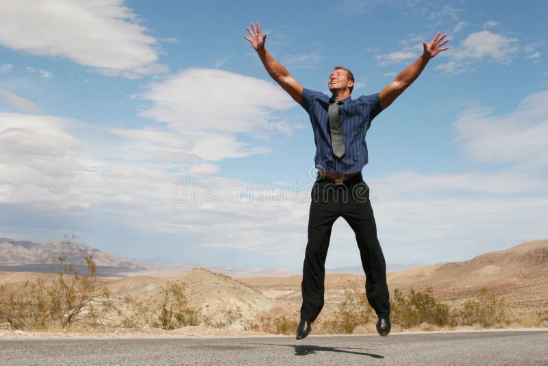 Excited successful business man jumping in the air. Excited successful business man jumping in the air