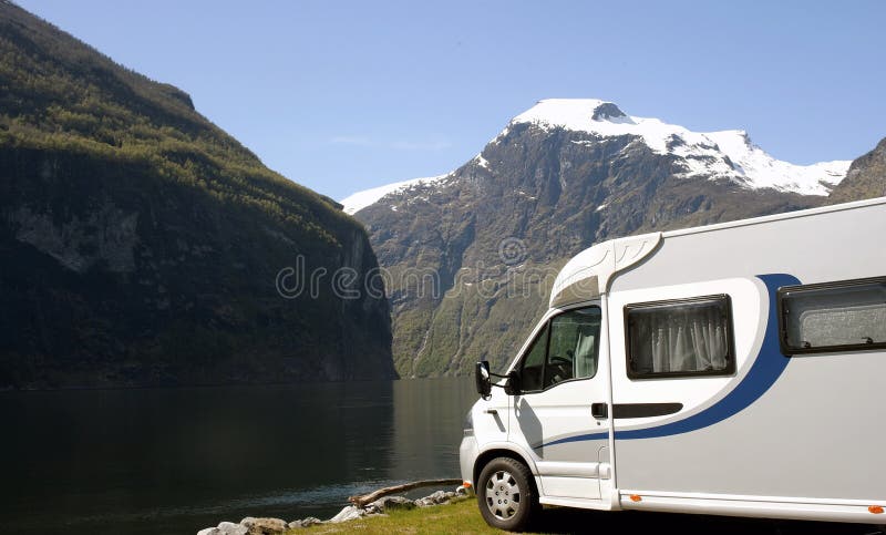 Motorhome parked at the campsite at riverside , Geirangerfjord. Motorhome parked at the campsite at riverside , Geirangerfjord