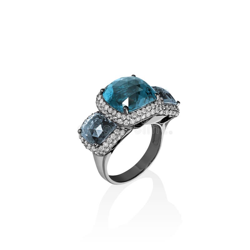El anillo de oro blanco con el topacio azul y los diamantes múltiples, amortiguador cortaron gemas fotos de archivo El anillo de oro blanco con el topacio azul y los diamantes múltiples, amortiguador cortaron gemas fotos de archivo