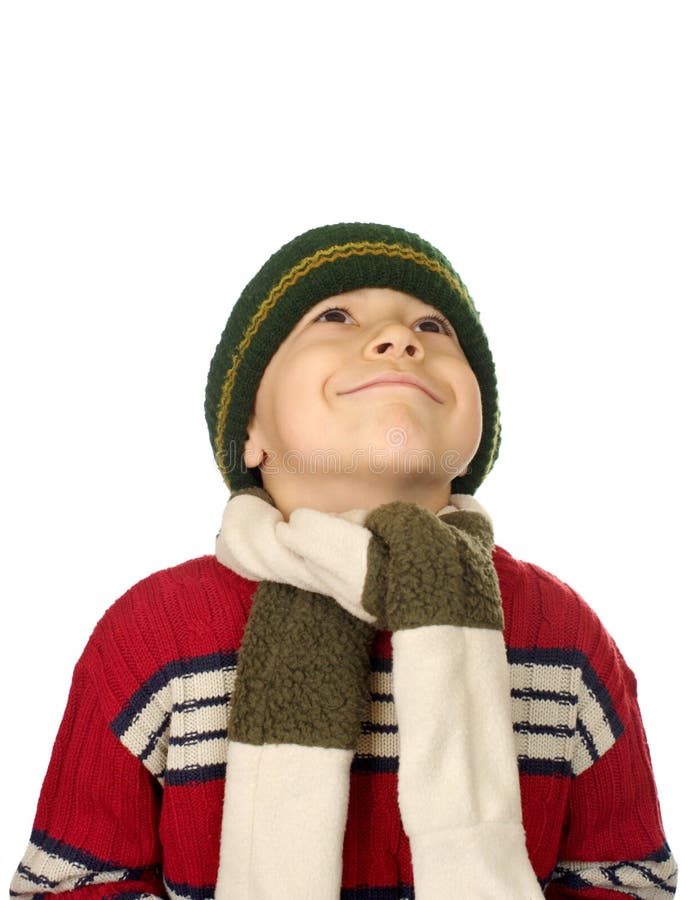 Eight-year-old boy in winter clothes looking up smiling, isolated on white background. Eight-year-old boy in winter clothes looking up smiling, isolated on white background