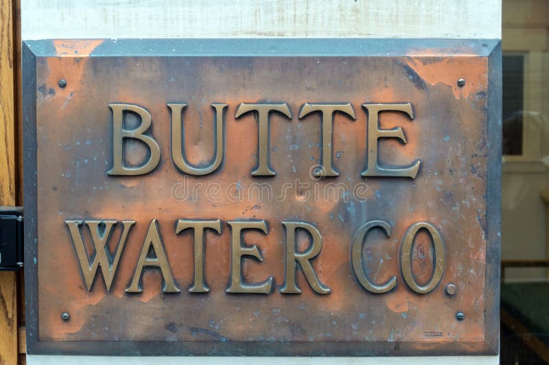 Butte, Montana, USA - July 30, 2014: The copper sign affixed to the Butte Water Company building. Butte, Montana, USA - July 30, 2014: The copper sign affixed to the Butte Water Company building