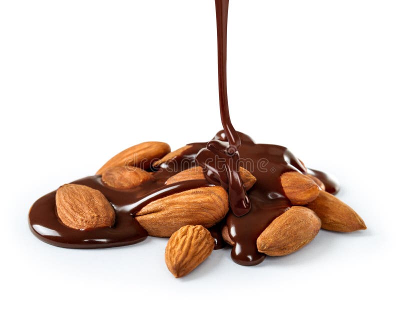El chocolate se vierte sobre una pila de medallas foto de archivo El chocolate se vierte sobre una pila de medallas foto de archivo