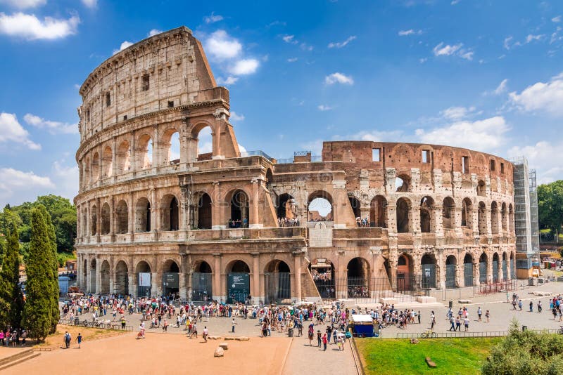Colosseum at midday, Rome. Rome architecture and landmark. Rome Colosseum is one of the best known monuments of Rome and Italy. Colosseum at midday, Rome. Rome architecture and landmark. Rome Colosseum is one of the best known monuments of Rome and Italy