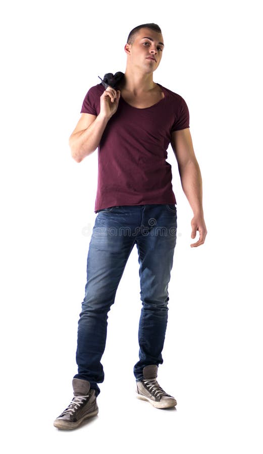 El cuerpo completo tiró de hombre joven hermoso con la camiseta y vaqueros fotografía de archivo El cuerpo completo tiró de hombre joven hermoso con la camiseta y vaqueros fotografía de archivo