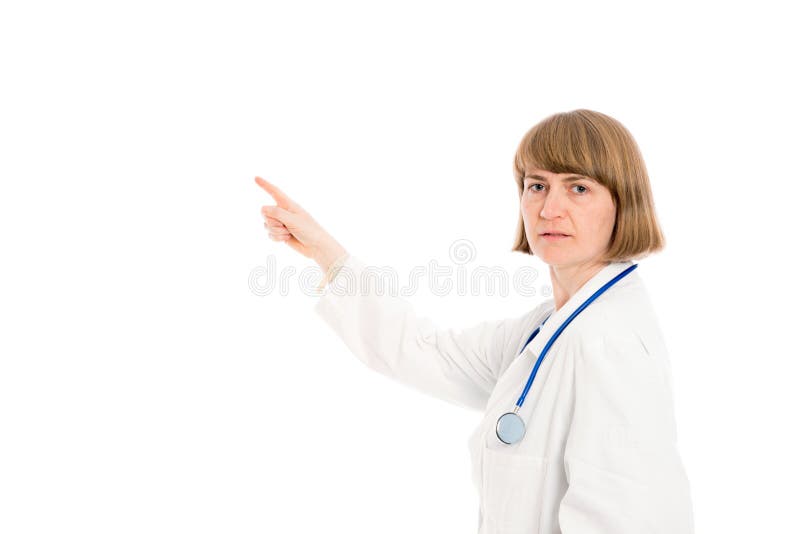 El doctor de sexo femenino joven está señalando de lado foto de archivo libre de regalías El doctor de sexo femenino joven está señalando de lado foto de archivo libre de regalías