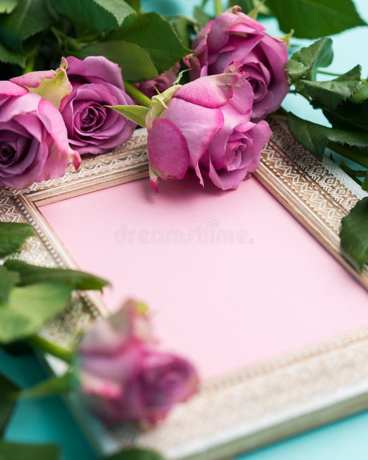 Happy Mother`s Day, Women`s Day, Valentine`s Day or Birthday Flat Lay Background. Beautiful wooden vintage picture frame, fresh pink roses and copy space. Happy Mother`s Day, Women`s Day, Valentine`s Day or Birthday Flat Lay Background. Beautiful wooden vintage picture frame, fresh pink roses and copy space.