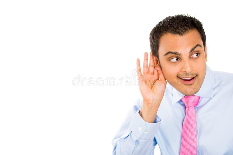 Closeup portrait of handsome guy trying to secretly listen in on a conversation, privacy violation, isolated on white background with copy space. Closeup portrait of handsome guy trying to secretly listen in on a conversation, privacy violation, isolated on white background with copy space