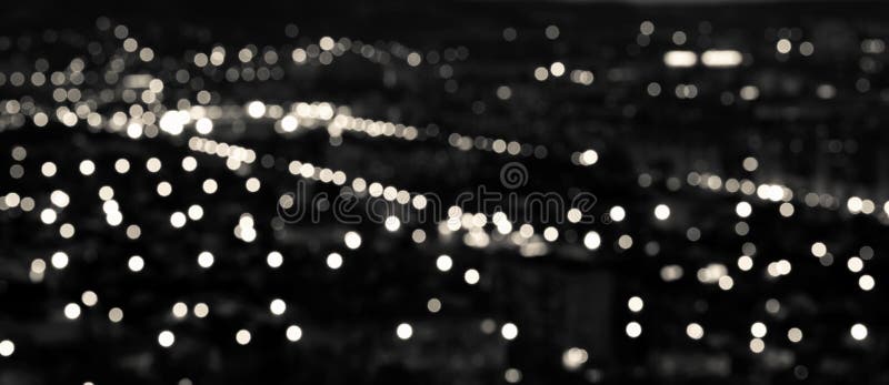 El fondo circular negro blanco abstracto del bokeh, ciudad se enciende en t foto de archivo libre de regalías
