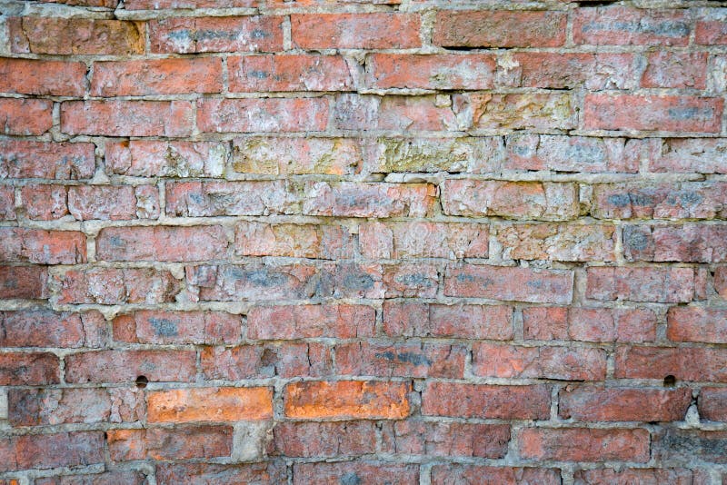 El fondo de la pared de ladrillo vieja fotografía de archivo El fondo de la pared de ladrillo vieja fotografía de archivo