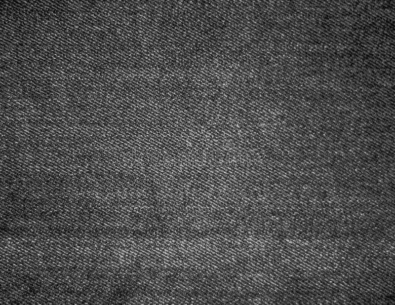 El fondo negro de la textura de los vaqueros del dril de algodón se puede utilizar como orientación horizontal del papel pintado fotos de archivo El fondo negro de la textura de los vaqueros del dril de algodón se puede utilizar como orientación horizontal del papel pintado fotos de archivo