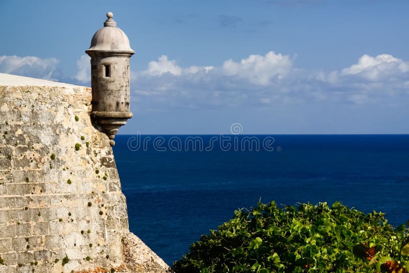 A beautiful view of a guerite, or sentry box, along the coastal side of El Morro in Old San Juan, Puerto Rico. Castillo San Felipe del Morro, or the San Felipe del Morro Castle, designed to help protect San Juan from land based attacks. El Morro is a popular destination for those visiting San Juan on a cruise ship. A beautiful view of a guerite, or sentry box, along the coastal side of El Morro in Old San Juan, Puerto Rico. Castillo San Felipe del Morro, or the San Felipe del Morro Castle, designed to help protect San Juan from land based attacks. El Morro is a popular destination for those visiting San Juan on a cruise ship.