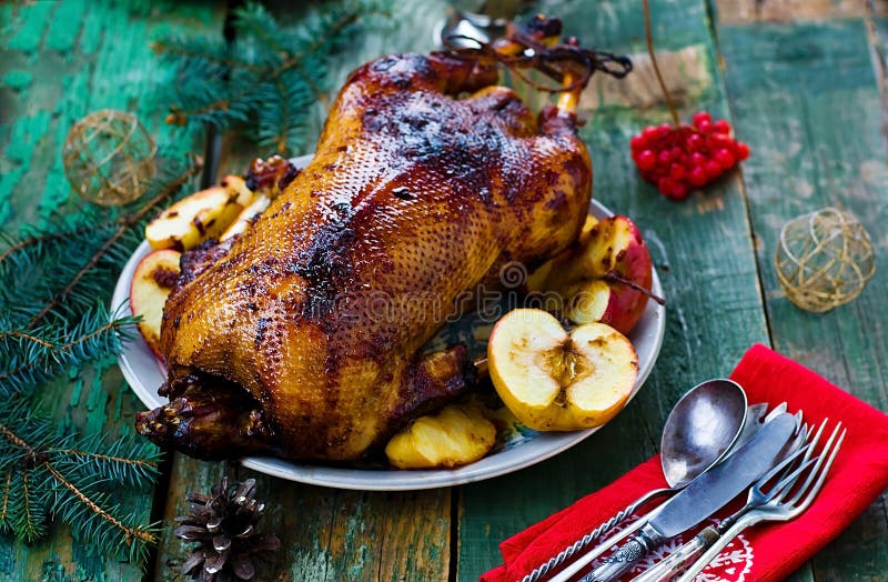 The Christmas baked goose with apples. vintage style. The Christmas baked goose with apples. vintage style.