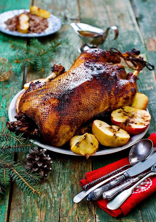 The Christmas baked goose with apples. vintage style. The Christmas baked goose with apples. vintage style.