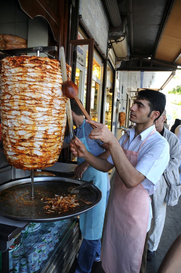 Doner kebab is a turkish dish made of meat cooked on a vertical rotisserie, normally lamb but sometimes beef, or chicken. A man slices the meat at the bazaar in Urfa. Doner kebab is a turkish dish made of meat cooked on a vertical rotisserie, normally lamb but sometimes beef, or chicken. A man slices the meat at the bazaar in Urfa